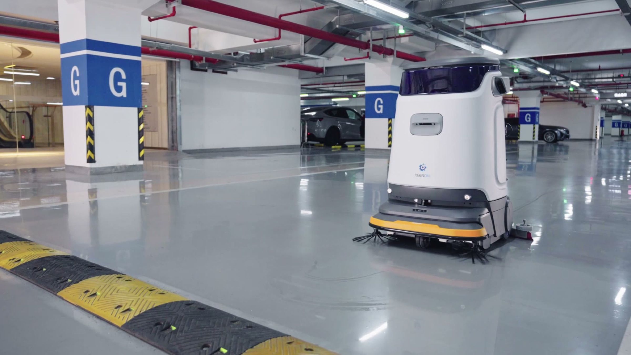 Large-format autonomous scrubber cleaning an underground car park floor